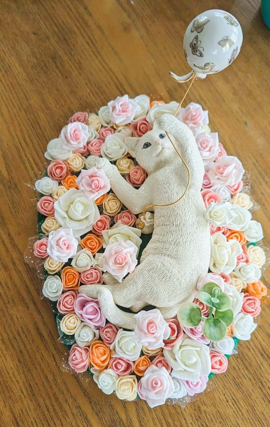 Center piece porcelain cat with forever roses garden.